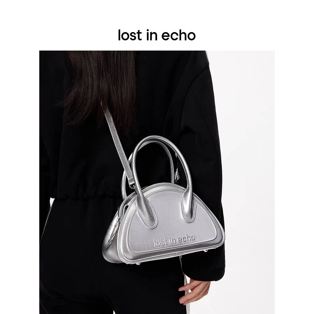Lost In Echo Embossed Logo Leather Bowling Bag Sliver - Mores Studio
